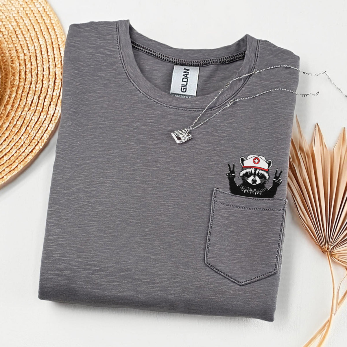raccoon_nurse_pocket_dark_grey Raccoon Nurse Pocket T-Shirt - Image 1
